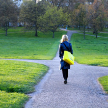 woman approaching a crossroads