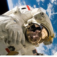 Astronaut spacewalking above Earth