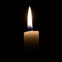 A picture of a candle in the dark