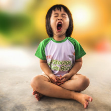 girl yawning whilst seated