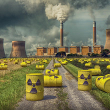 Yellow barrels of nuclear waste photoshopped in front of a nuclear power plant