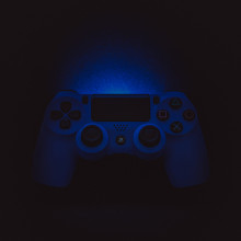 A playstation controller in the dark