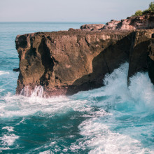 Ocean waves crashing against a headland