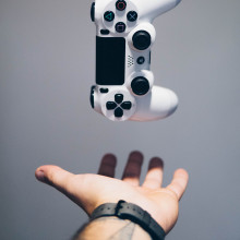 A picture of a levitating PlayStation controller
