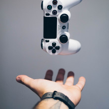 A picture of a levitating PlayStation controller