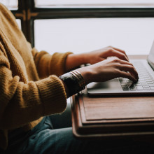 A person sitting on a laptop working