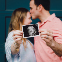 Couple holding ultrasound baby scan