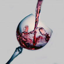 Pouring a glass of red wine