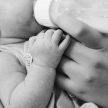 Baby being fed with a bottle