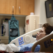 A patient lying in a hospital bed.