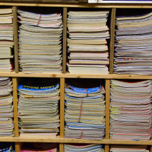 Journals on a bookshelf