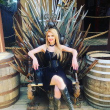A woman sitting on the iron throne