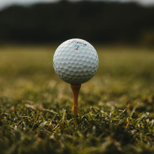 GOLF BALL A golf ball on a tee