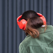 Person listening using headphones