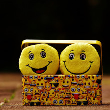 An image of two cartoon smiley faces in a box