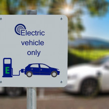 A sign for an electric vehicle charging station.