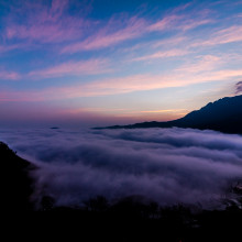 A view of low clouds and mountain ranges in China's Yunnan province.