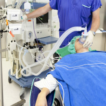 A patient on a ventilator in a hospital.