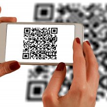 QR code being read by phone in hands