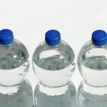 three clear glass bottles