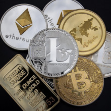 Various coins with cryptocurrency logos.