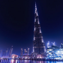 The nighttime skyline of Dubai, featuring the Burj Khalifa.