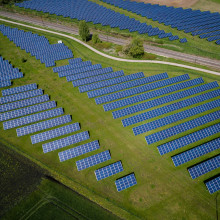 Solar panels in a field from an aerial view