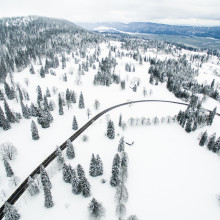 A road running through snowy mountains