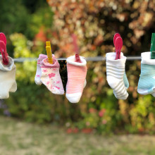 Colourful socks hanging on a washing line