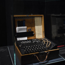 An enigma codebreaking machine behind glass