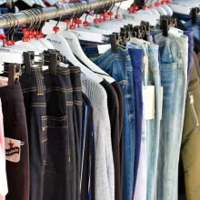 Different denim jeans on a clothes rail