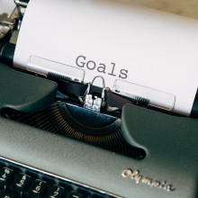 Typewriter with paper saying 'Goals'