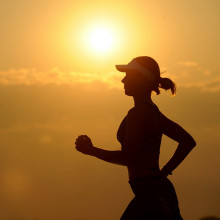 Woman running in the sunset