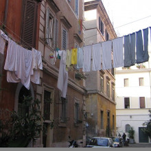 Laundry is hung to dry above an Italian street.