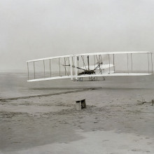 First successful flight of the Wright Flyer, by the Wright brothers. The machine traveled 120 ft (36.6 m) in 12 seconds at 10:35 a.m. at Kitty Hawk, North Carolina. Orville Wright was at the controls of the machine, lying prone on the lower wing with...