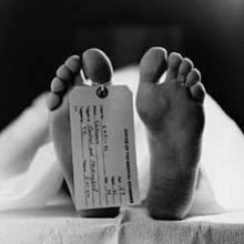 A toe tag is put on a toe of a dead body for identification reasons in morgues