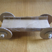A car with a small axle made out of toilet roll cardboard