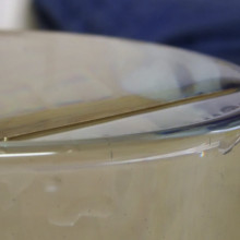 The needle is held up by surface tension